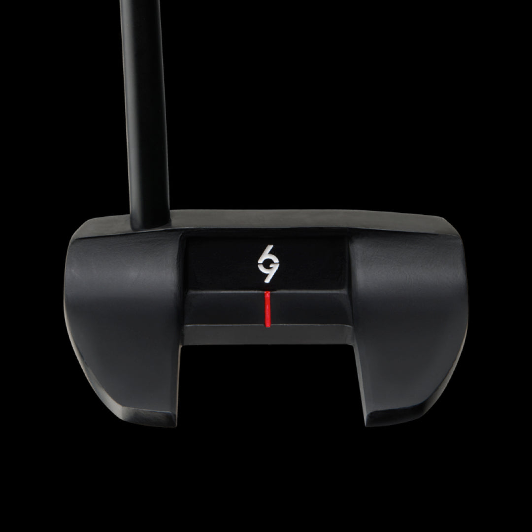 Black putter with mallet-style head, white "69" logo, red alignment line, and black shaft against dark background.